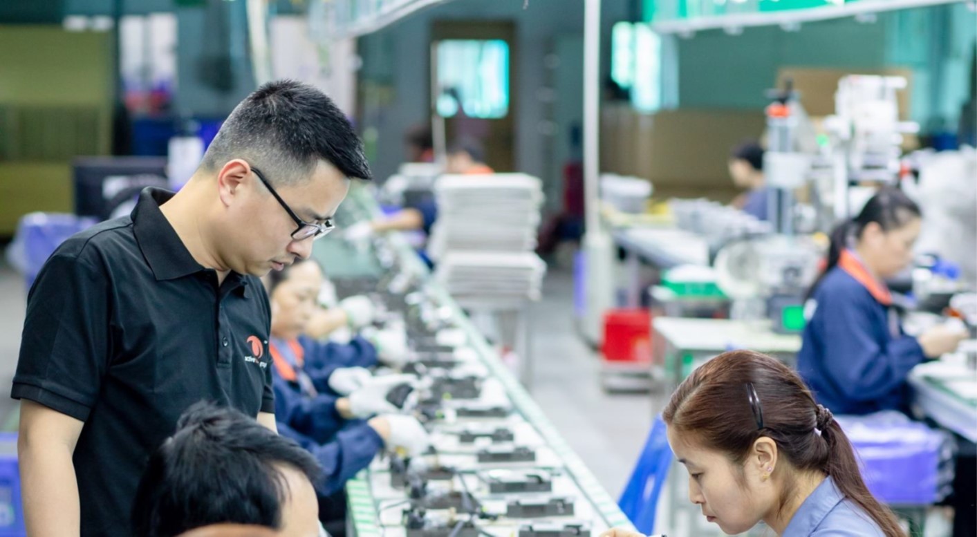 Dr. Louis Lam inspects the progress of a production line in Active Tools’ Dongguan plant.