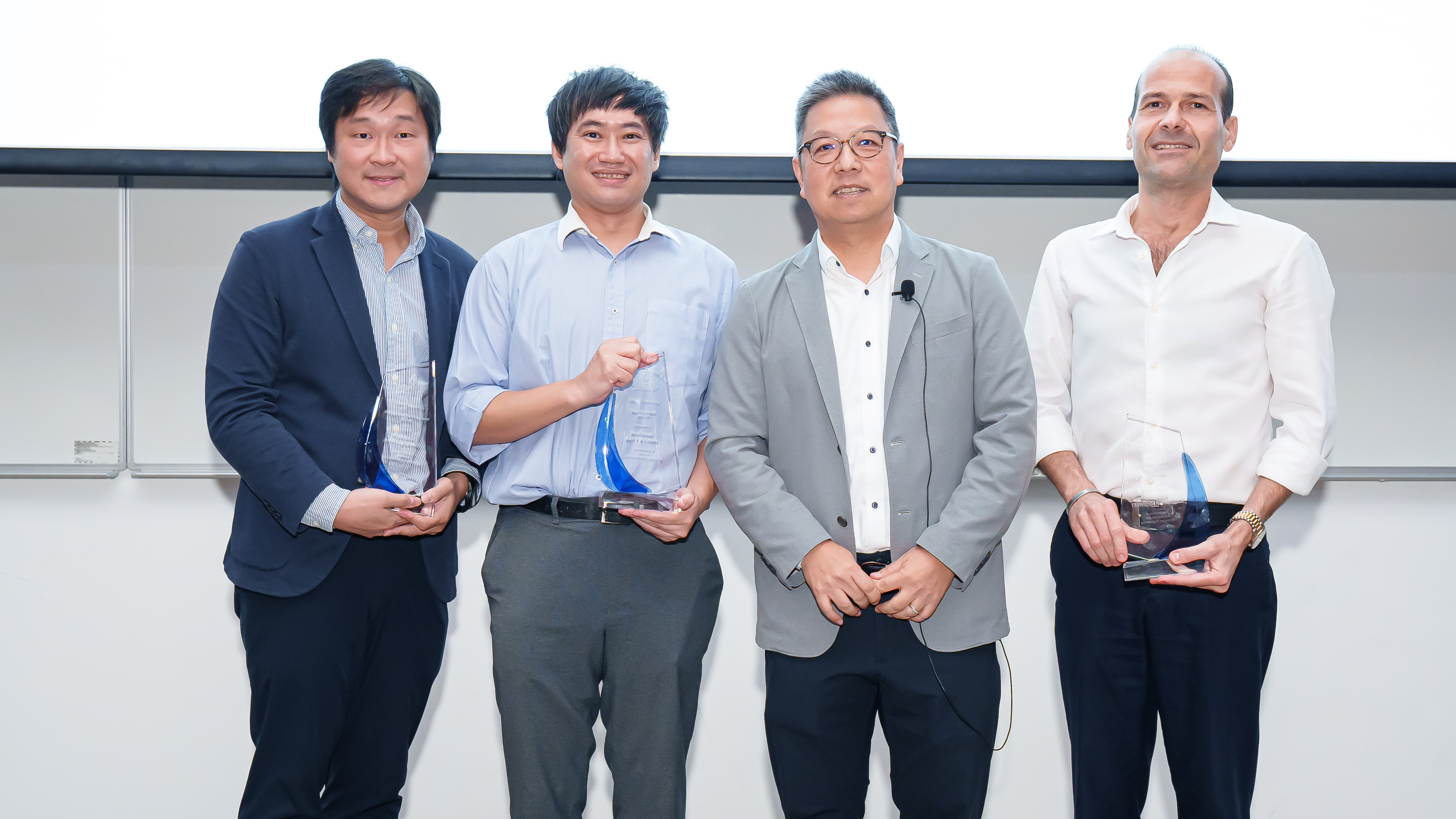 (from left) Prof. Anthony LEUNG Kwan, Prof. Ben CHAN Yui-Bun, and Prof. Stephane REDONNET(1st right), were presented with the awards by Prof. Hong K. LO (2nd right).