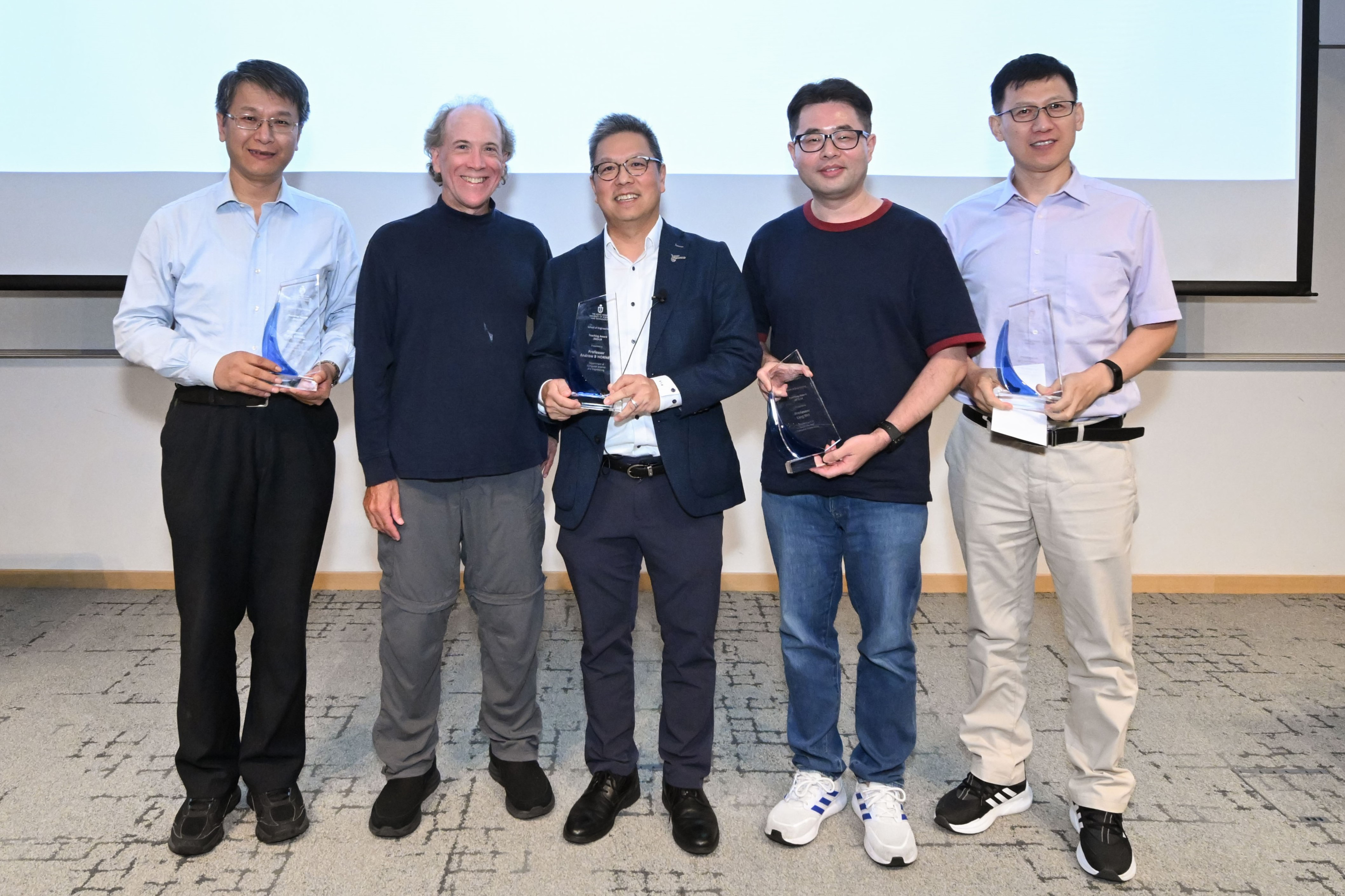 Recipients of the School of Engineering Teaching Excellence Appreciation Award 2023-24: Prof. WANG Gang (first left), Prof. Andrew HORNER (second left), Prof. SHI Ling (second right) and Prof. Marshal LIU (first right), were presented with the awards by Prof. Hong K. LO (center).