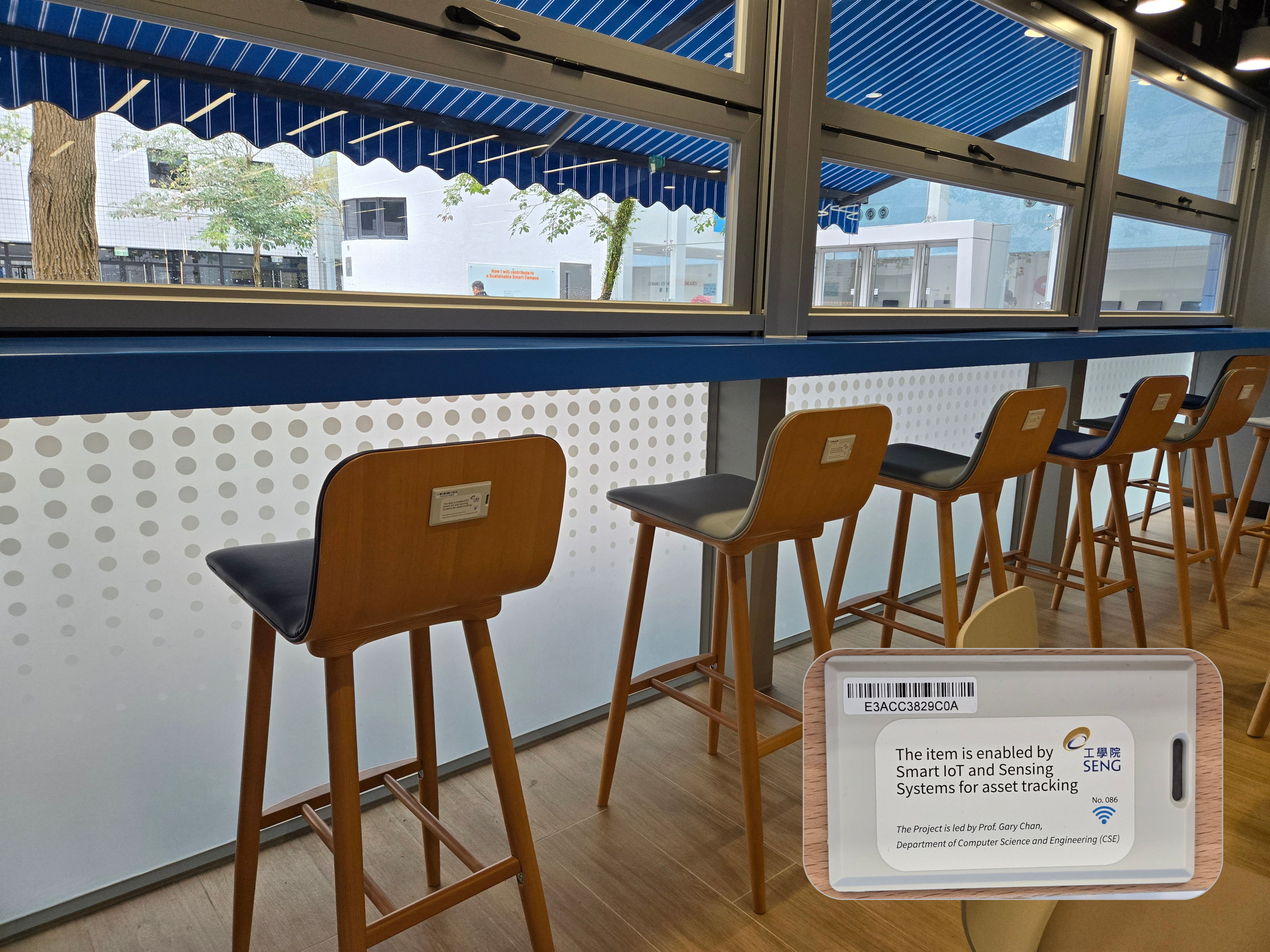 The photo shows the Bluetooth tags affixed to the back of the chairs at the Engineering Commons, with a close-up image of the tag in the bottom right corner.