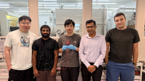 Group photo of the research team: Prof. Abhishek K. Srivastava (second right), corresponding author of the study; Liao Zebing (center), PhD student and first author of the study; as well as co-authors including postdoctoral fellow Dr. Maksym Prodanov (first right), PhD students Mallem Kumar (second left) and Song Jianxin (first left). Mr Liao holds a red emitting QR-LED sample.