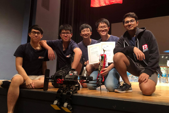 The winning team: (from left) Mak Ka-Hei, Leung Pok-Man, Mak Kin-Wing, Lee Chun-Hei and Amrutavarsh Sanganabasappa Kinagi, with their autonomous biped robot in front