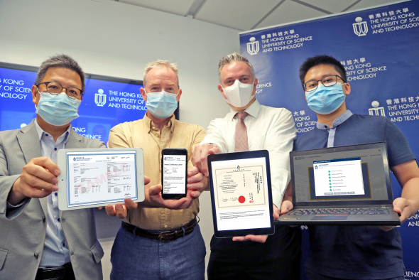 (From right) Prof. Chen Qifeng, Assistant Professor of the Department of Computer Science and Engineering at HKUST; Mr. James Prince, Academic Registrar, HKUST; Mr. Davis Bookhart, Senior Manager and Head, HKUST Sustainability Unit; and Prof. Lo Hong-Kam, Director of HKUST’s GREAT Smart Cities Institute demonstrate how different HKUST documents can be verified using different devices.