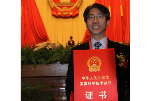 Vice-President Prof Joseph Lee with his award certificate in the Great Hall of the People