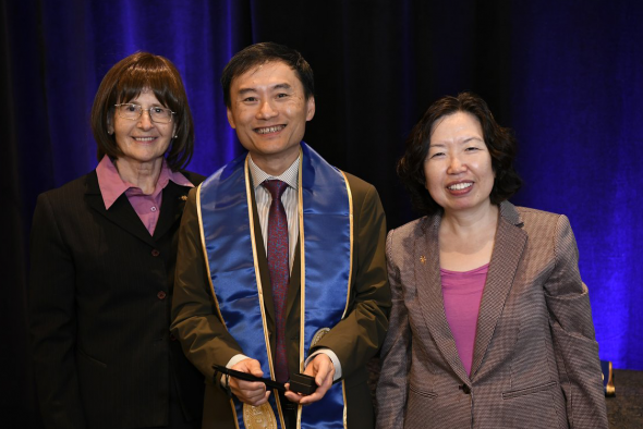 Prof. Gary Chan Shueng-Han (center) was elected as a Sigma Xi Fellow in the 2023 cohort for his contributions to enterprises through scientific research.