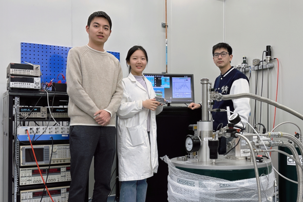 A photo of authors with a cryogenic system: Prof. Shao Qiming (right), PhD students Qian Kun (center) and Liu Ruizi (left) from the Department of Electronic and Computer Engineering.