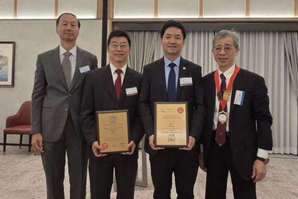 Newly elected HKAE Fellows Prof. Fan Zhiyong (second right) and Prof. Zhang Limin (second left), along with Ir Dr. Alex Chan Siu-Kun (first right), HKAE President, and Prof. Kwok Hoi-Sing, Visiting Professor of the Department of Electronic and Computer Engineering and also HKAE Fellow.