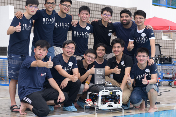 HKUST’s Robotics Team leader Prof Woo Kam Tim (second left, front row), his team members and their ROV Beluga.