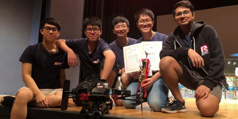 The winning team: (from left) Mak Ka-Hei, Leung Pok-Man, Mak Kin-Wing, Lee Chun-Hei and Amrutavarsh Sanganabasappa Kinagi, with their autonomous biped robot in front