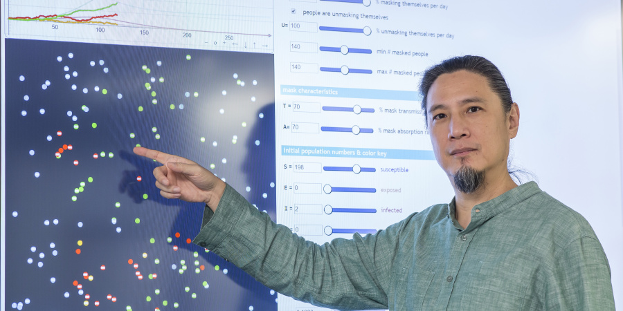 De Kai, Professor of Computer Science and Engineering, demonstrates how the interactive visualization of the simulation works.