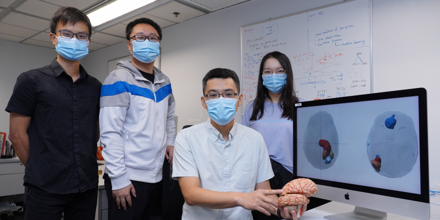 Prof. Wang Jiguang (second right) and his research team members