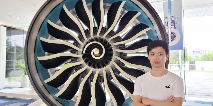 James with an airplane engine at GE Aviation, Shanghai.