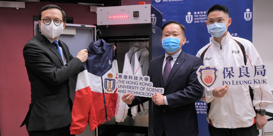 Prof. Ricky LEE Shi-Wei (middle), Chair Professor of the Department of Mechanical and Aerospace Engineering at HKUST, demonstrates how the UVC LED disinfection closet works, along with Mr. LAM Kwok-Wai (left) and Mr. Martin MAK, Principal and Assistant Warden respectively of the Po Leung Kuk Yu Lee Mo Fan Memorial School.
