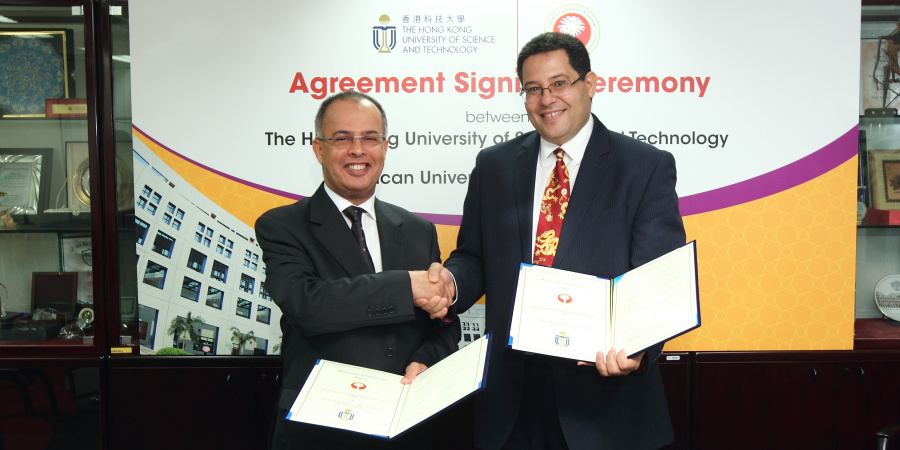 HKUST Dean of Engineering Prof Khaled Ben Letaief and AURAK Vice Chancellor Prof Hassan Al Alkim sign the memorandum at HKUST campus.