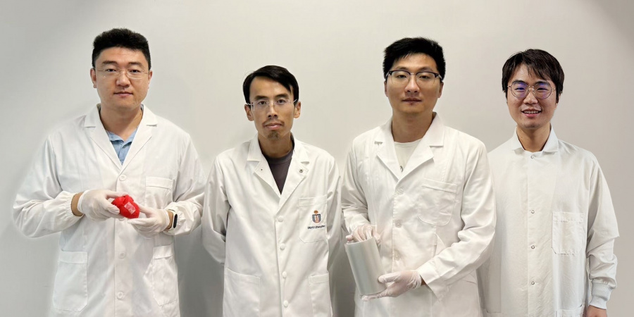 Prof. Yang Zhengbao (second left), Associate Professor at HKUST’s Department of Mechanical and Aerospace Engineering, with the three co-first authors of the study: HKUST postdoctoral fellow Dr. Li Xuemu (second right, holding a roll of printed glycine films), CityU PhD graduate Dr. Zhang Zhuomin (first right), and CityU PhD Student Zheng Yi (first left, with a glycine patch in his hands).