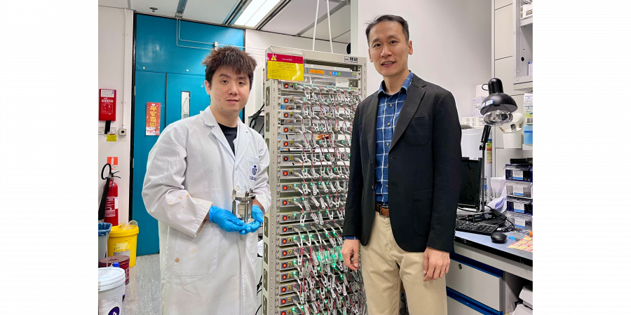 Prof. Kim Yoonseob (right), Associate Professor in the Department of Chemical and Biological Engineering and the study’s corresponding author, stands with his PhD student Gu Muhua (left), the paper’s first author, who is holding a solid-state battery cell mold. They are pictured beside a battery cell cycler.