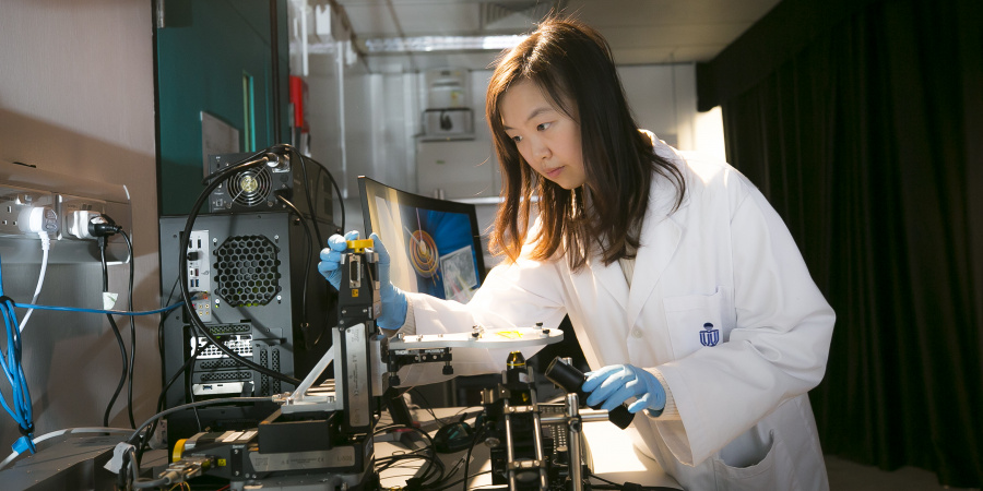 Ivy at work on the CHAMP microscope, which she sees as a really meaningful development for cancer patients.