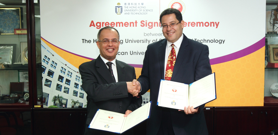 HKUST Dean of Engineering Prof Khaled Ben Letaief and AURAK Vice Chancellor Prof Hassan Al Alkim sign the memorandum at HKUST campus.