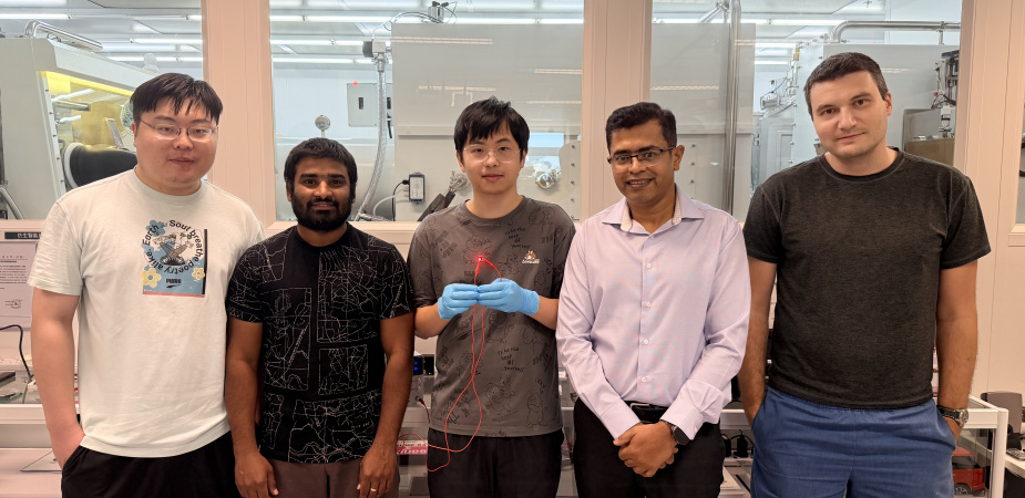 Group photo of the research team: Prof. Abhishek K. Srivastava (second right), corresponding author of the study; Liao Zebing (center), PhD student and first author of the study; as well as co-authors including postdoctoral fellow Dr. Maksym Prodanov (first right), PhD students Mallem Kumar (second left) and Song Jianxin (first left). Mr Liao holds a red emitting QR-LED sample.