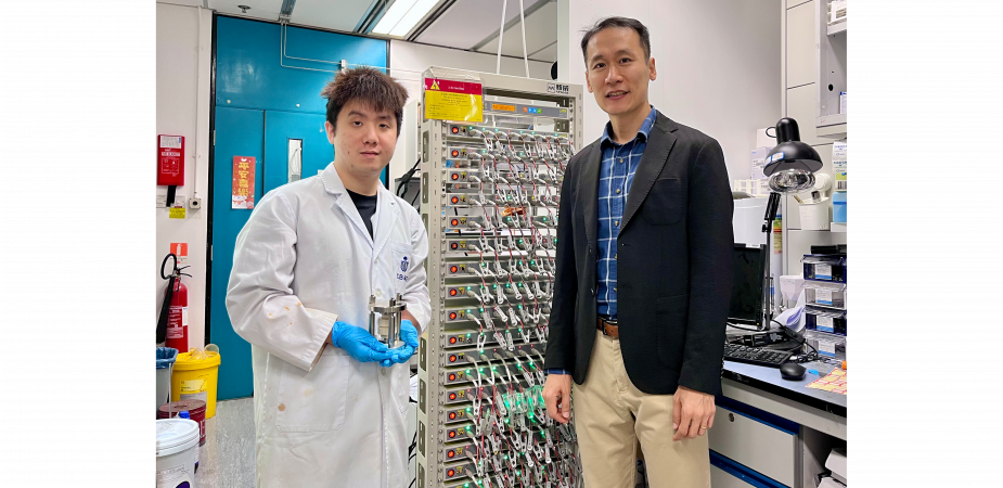 Prof. Yoonseob Kim (right), Associate Professor in the Department of Chemical and Biological Engineering and the study’s corresponding author, stands with his PhD student Gu Muhua (left), the paper’s first author, who is holding a solid-state battery cell mold. They are pictured beside a battery cell cycler.