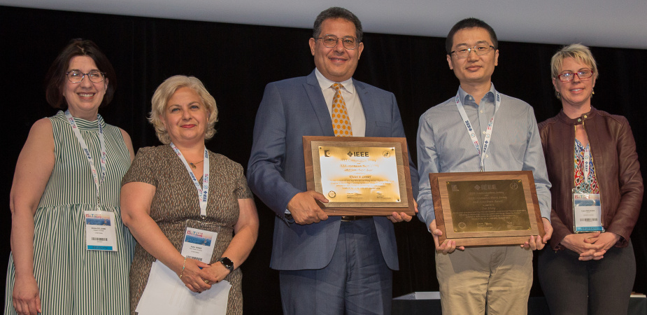 Prof. Khaled BEN LETAIEF (center) and Prof. ZHANG Jun (second right) received the award at the 2019 IEEE International Symposium on Information Theory in Paris on July 9.	