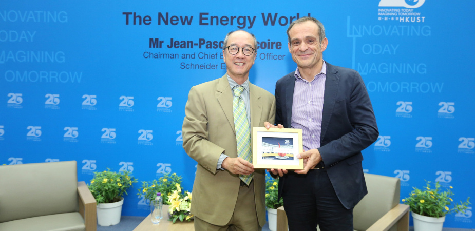 President Tony Chan (left) presents a souvenir to Mr Tricoire.
