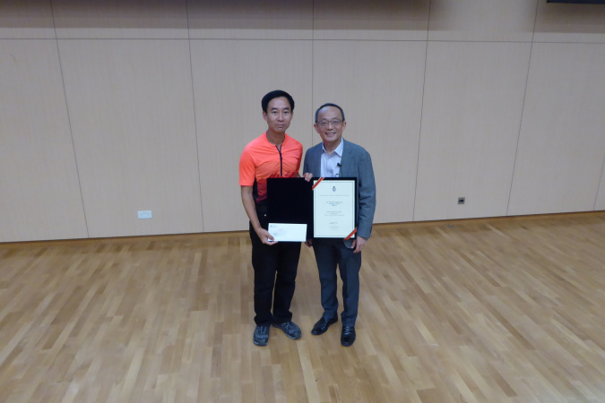 Prof. Mansun Chan (left) received the Teaching Award from Prof. Tim Cheng.