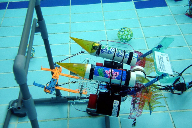 A student-made robot is scoring the goal.