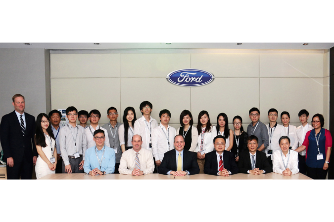 Grant recipients presenting their research findings to Ford executives in Bangkok, Thailand.