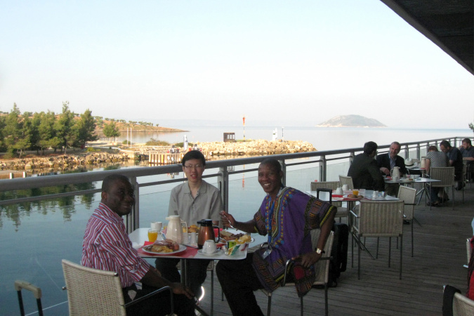 Ade enjoys an alfresco breakfast with his HKUST research fellow and friend during the 21st European Symposium on Computer-Aided Process Engineering (Escape-21) in Greece in 2011.