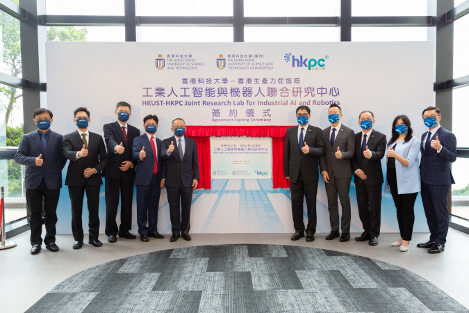 HKUST Vice-President for Research & Development Prof. Tim Cheng (5th left), HKUST(GZ) Vice-President for Graduate Support Prof. Charles Ng (4th left), HKPC Executive Director Mr. Mohamed Butt (5th right), HKPC Chief Digital Officer Mr. Edmond Lai (4th right), HKUST Chair Professor of Computer Science & Engineering and Joint Lab Director Prof. Zhou Xiaofang (3rd left), HKPC General Manager of Robotics & Artificial Intelligence Division and Joint Lab Co-Director Dr. Ge Ming (3rd right), HKUST(GZ) Chair Profes