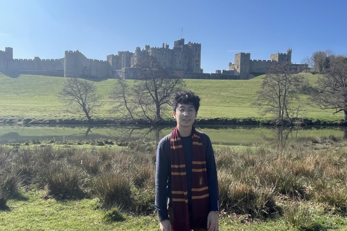 This is me standing in front of the Alnwick Castle, which is an over 1000 years-old castle. Also, It has been used as a set in many of the Harry Potter films.
