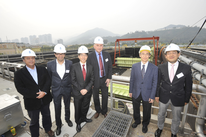 The consortium partners, joined by Mr Wing-cheong Fung (second from right), Senior Electrical & Mechanical Engineer, Electrical & Mechanical Projects Division of the Drainage Services Department, visit the SANI Sewage Treatment Plant at the Shatin Sewage Treatment Works.