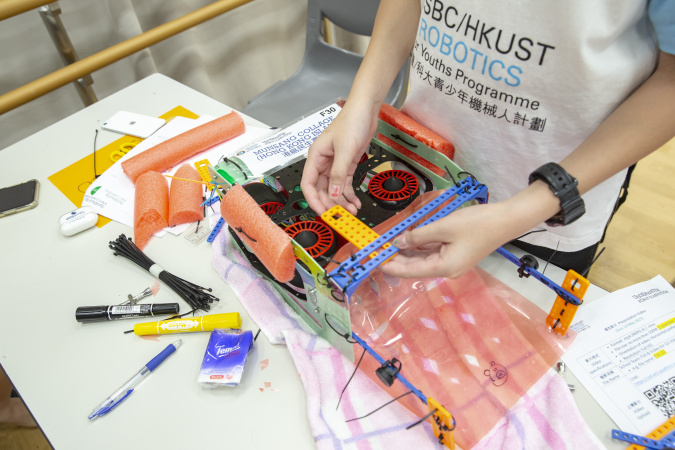 Students designed their robots using different materials in the final competition in May.