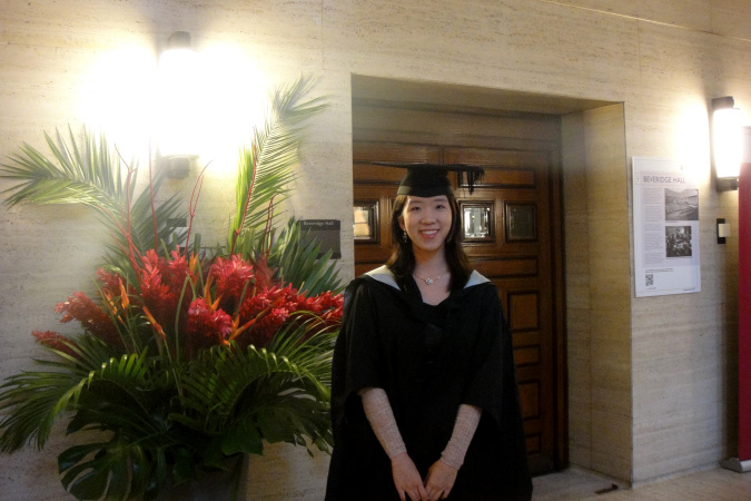 Gloria pose for a photo at the graduation ceremony for her MSc study.