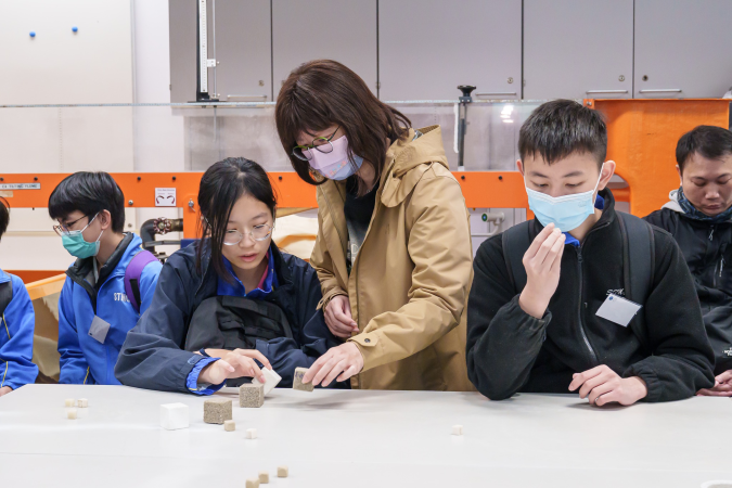Participants explored 3D-printed bricks in a Civil and Environmental Engineering lab.