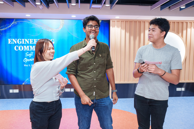 Student emcees Valerie Lee (left) and Conan Lee (right) asked how Engineering Student Ambassador Aditya Anand (center) liked the new Commons at the soft opening.