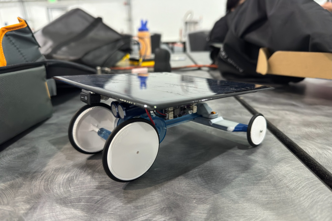 The HKUST team successfully created the fastest solar-powered robot and collected the gold medal in the Beam Speeder event.