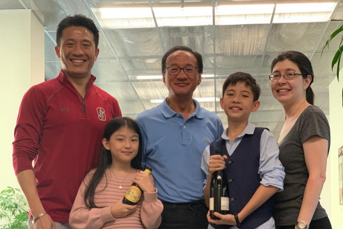 Prof. Patrick Yue (first left) with his family and Prof. S Simon Wong (center)