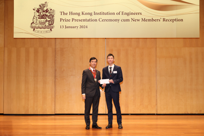 Eugene Cheung Hon (right) received a scholarship renewal letter from Ir Dr. Barry Lee, HKIE President for Session 2023/24.