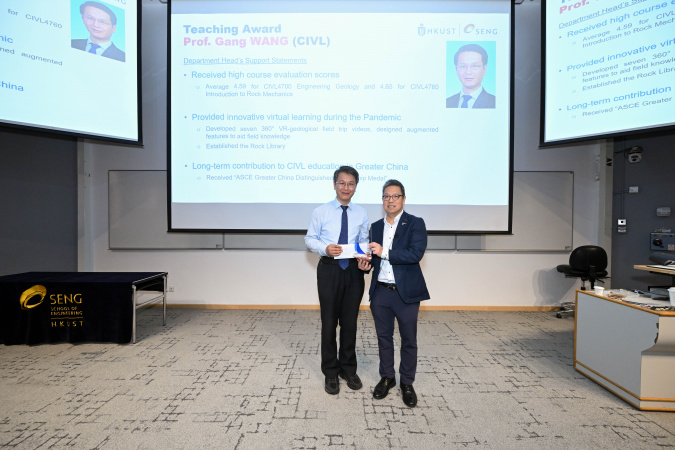 Prof. Wang Gang (left) received the award from Dean of Engineering Prof. Hong K. Lo.