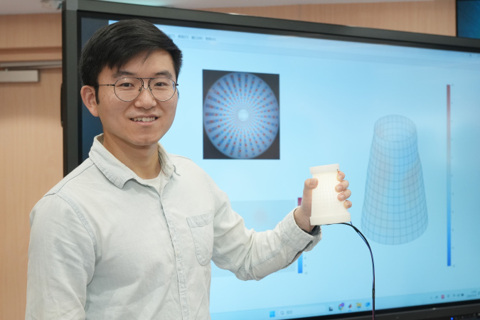 Mr. Tang Yifeng with the AI Hand-Centric Tactile Interaction System PhyTac. 