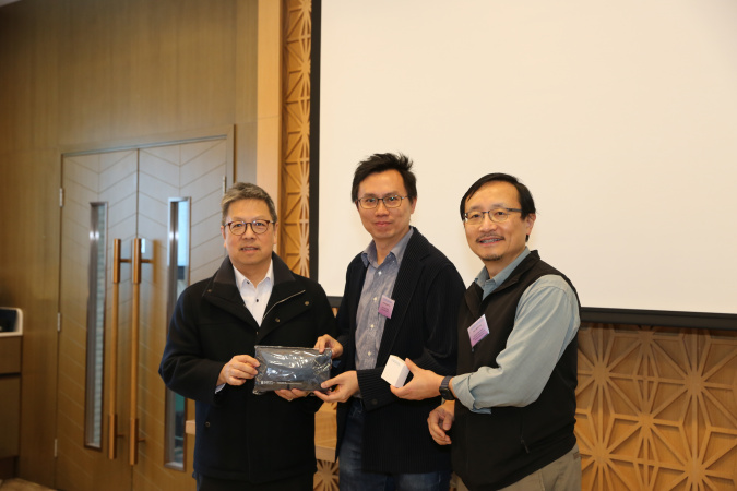 Mr. Christopher Ho (center) received a souvenir from Prof. Hong K. Lo (left) and Prof. Chen Yong (right).