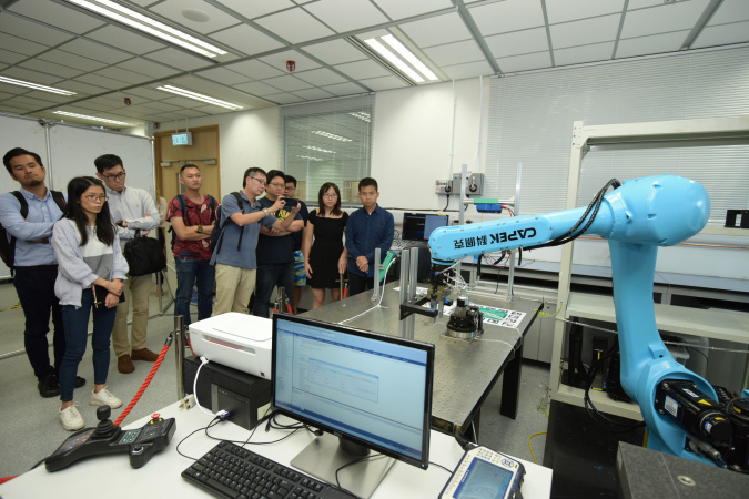Demonstration of a robotic arm at the HKUST Robotics Institute.