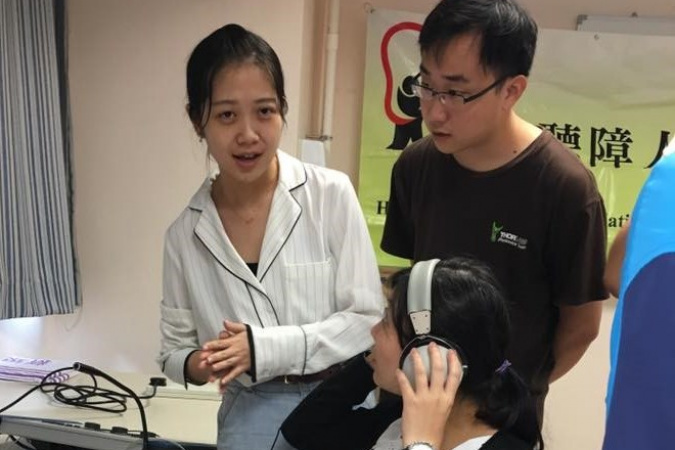 Students Tingyi and Jun demonstrated their simulated audio technology which enabled parents to experience what their hearing-impaired children are listening to every day.