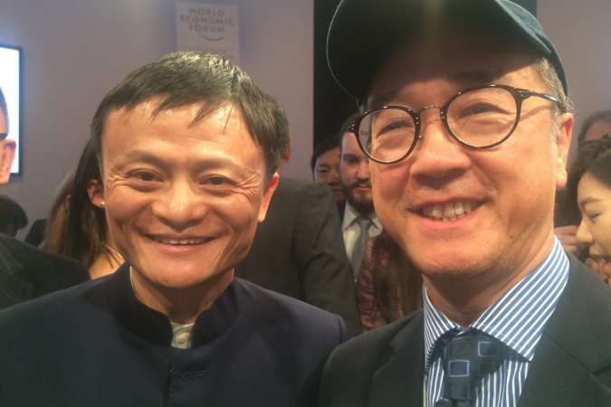 (From left) Dr Jack Yun Ma and Prof Tony F Chan attend the World Economic Forum.
