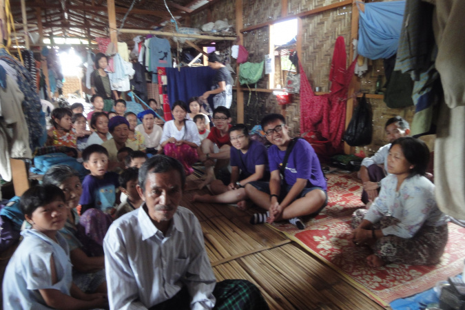 Kow (in purple t-shirt, front) visited the refugee camps in Myanmar to encourage the people there.