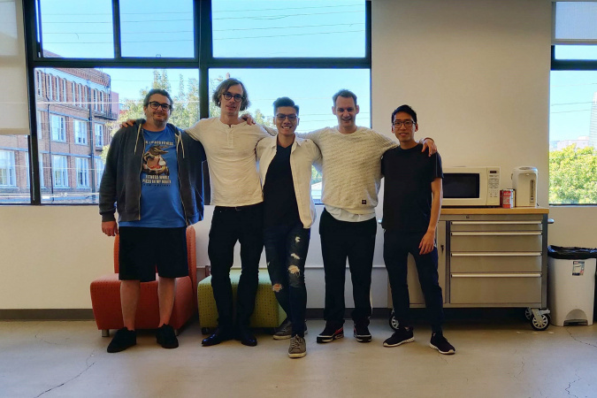 Alan (middle) poses for a photo with his colleagues at the start-up company he worked at during his internship in San Francisco.