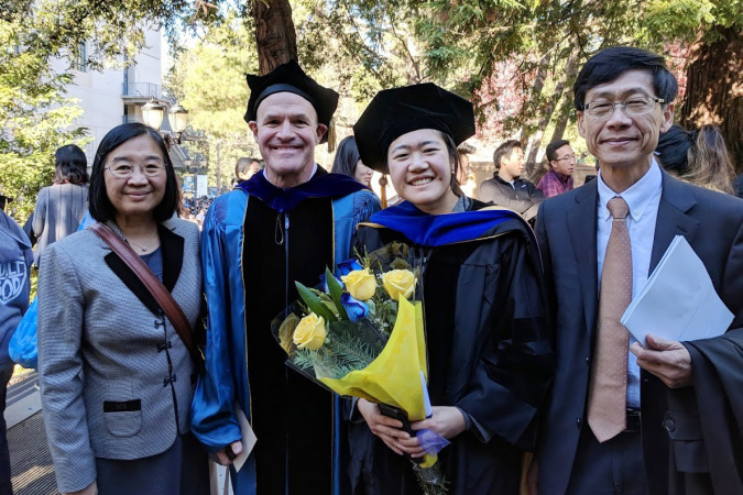Graduation photo of daughter Clara, with thesis advisor Prof. Jay Keasling of the University of California, Berkeley, and mom and dad.