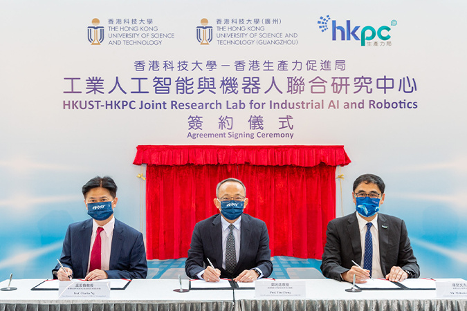(From left) Prof. Charles Ng Wang-Wai, Vice-President for Graduate Support of HKUST(GZ) and CLP Holdings Professor of Sustainability of HKUST; Prof. Tim Cheng, Vice-President for Research and Development of HKUST; and Mr. Mohamed Butt, Executive Director of HKPC, sign the agreement to establish HKUST-HKPC Joint Research Lab for Industrial AI and Robotics.